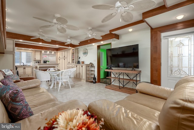 living area with beam ceiling