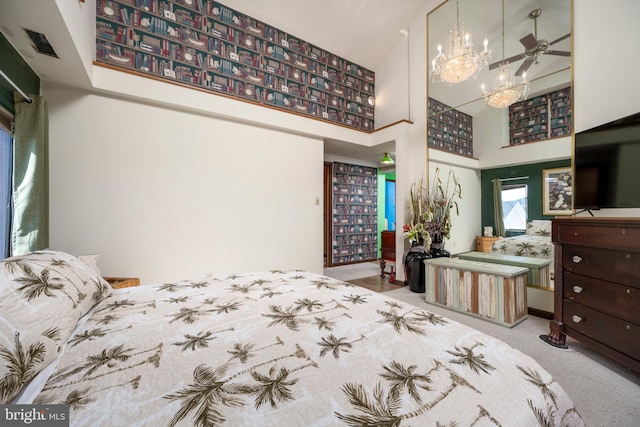 bedroom with carpet floors, a high ceiling, and an inviting chandelier