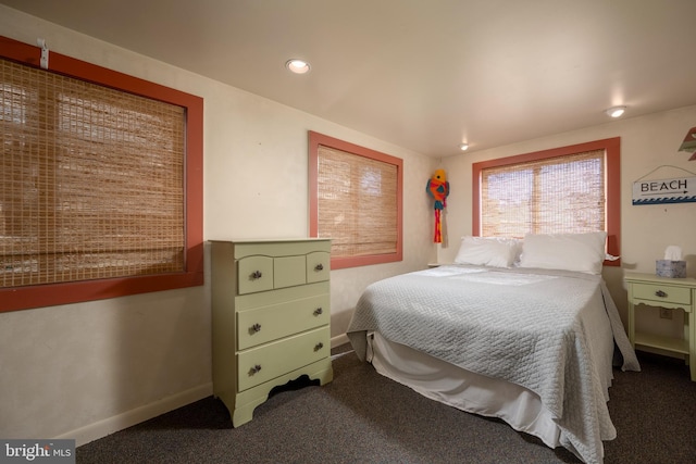 bedroom featuring baseboards and carpet floors