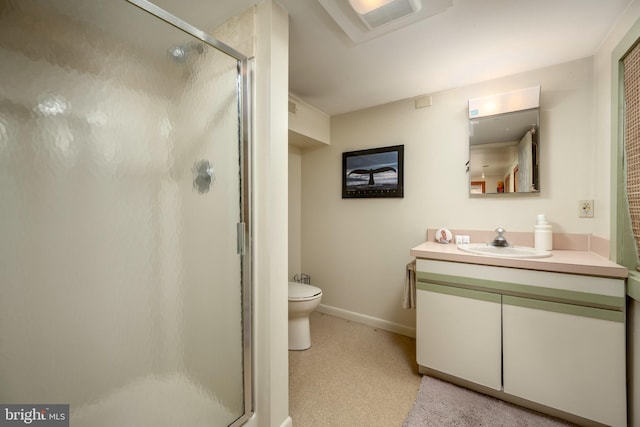 full bathroom with toilet, a stall shower, vanity, and baseboards