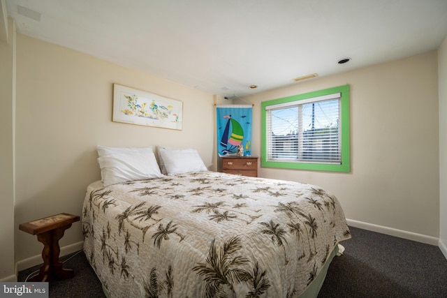 bedroom with visible vents, baseboards, and carpet