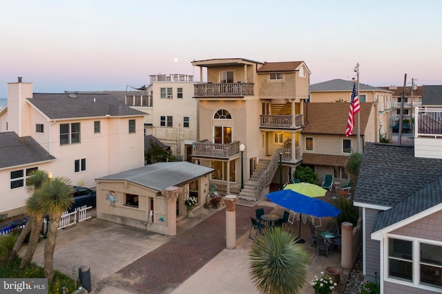 view of building exterior with stairway and a residential view