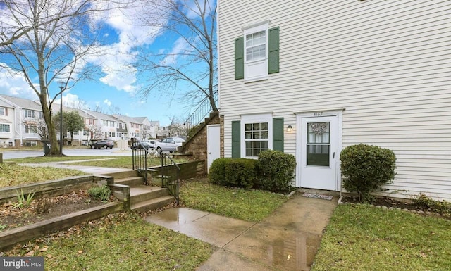 doorway to property with a residential view