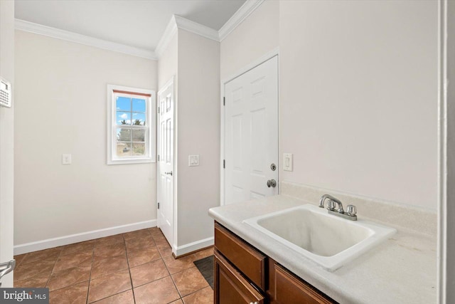 bathroom with tile patterned flooring, vanity, baseboards, and ornamental molding