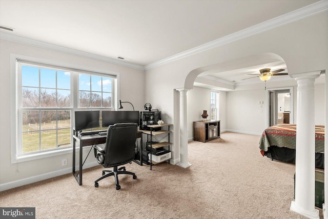 office with arched walkways, crown molding, carpet, and decorative columns