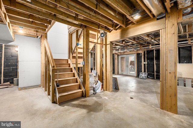 unfinished basement featuring stairway