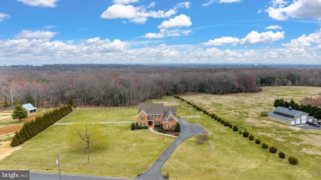 bird's eye view with a rural view and a view of trees