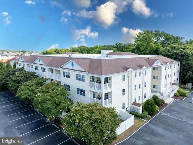 view of property with uncovered parking