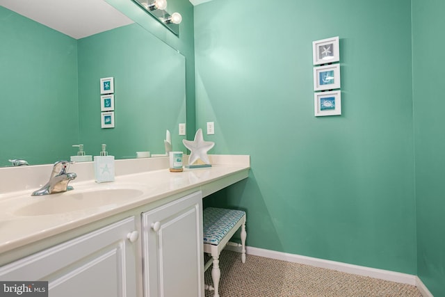 bathroom with vanity and baseboards