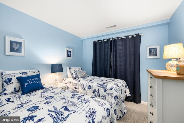 bedroom with visible vents and carpet floors