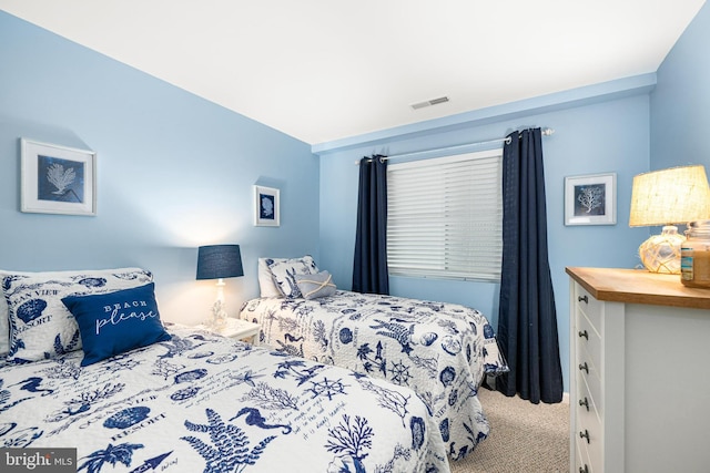 carpeted bedroom with visible vents