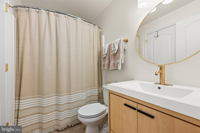 full bath featuring toilet and vanity