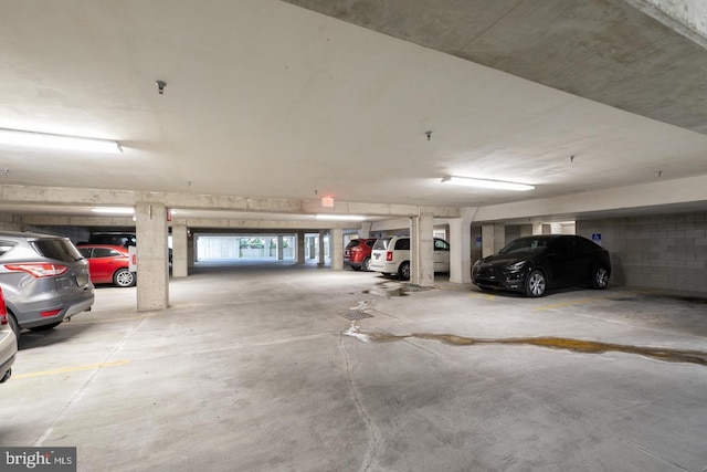 parking garage featuring concrete block wall