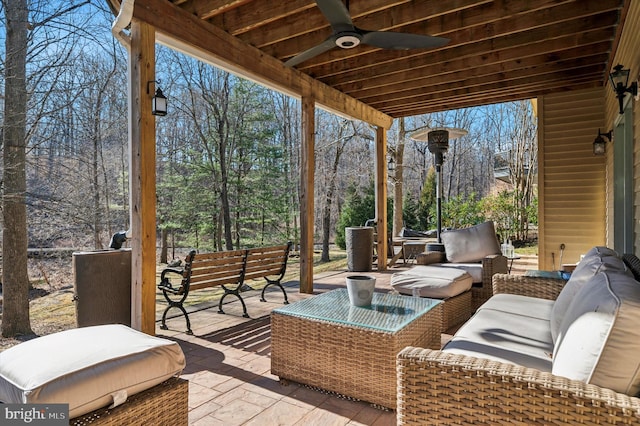 view of patio featuring an outdoor living space and a ceiling fan