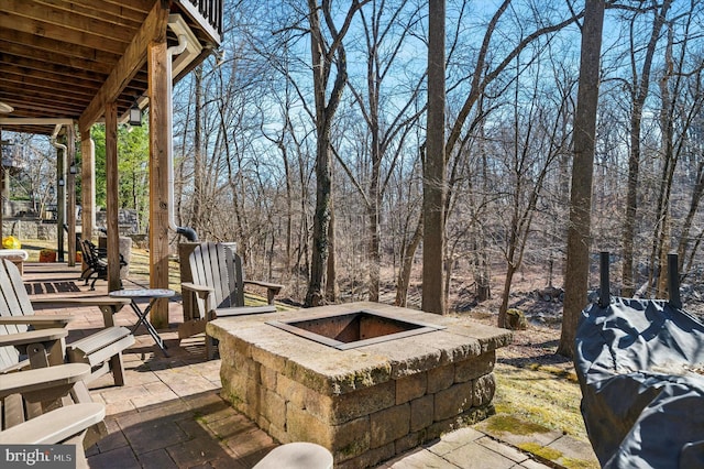 view of patio / terrace with a fire pit