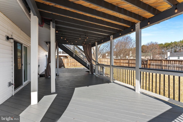 wooden terrace featuring fence