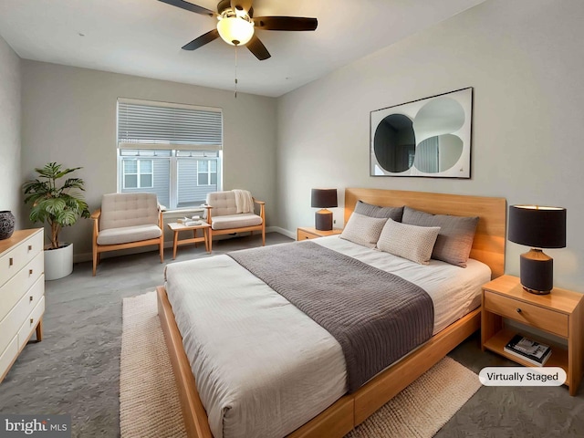 carpeted bedroom featuring a ceiling fan and baseboards