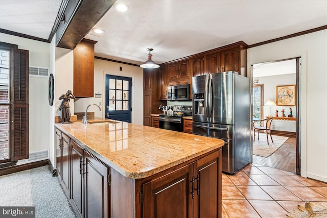 kitchen with light stone countertops, a peninsula, a sink, stainless steel appliances, and crown molding