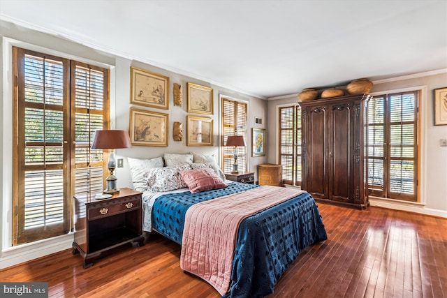 bedroom featuring hardwood / wood-style floors and ornamental molding