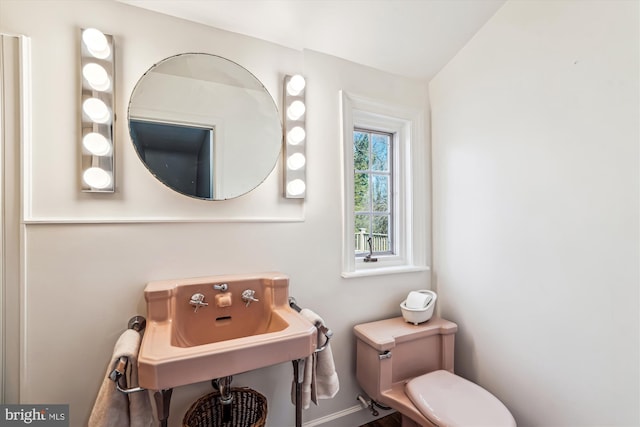 bathroom with toilet and a sink