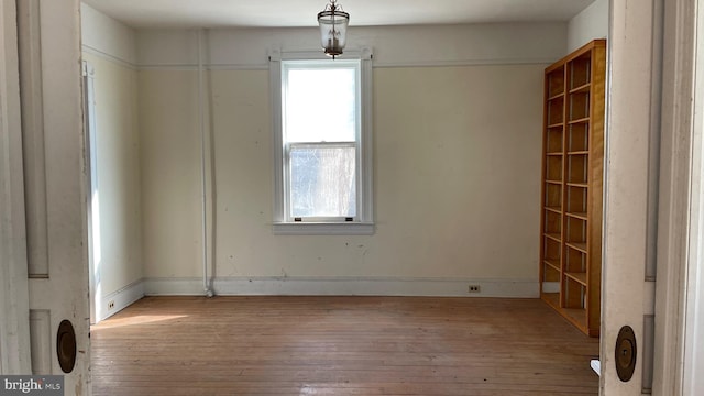 empty room featuring hardwood / wood-style flooring