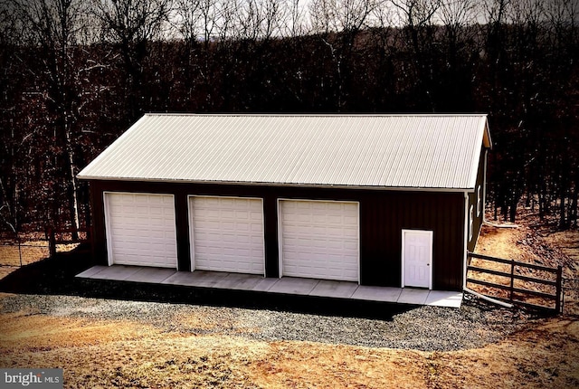 detached garage with fence