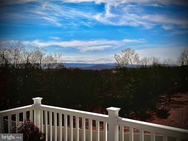 view of yard featuring a mountain view and a balcony