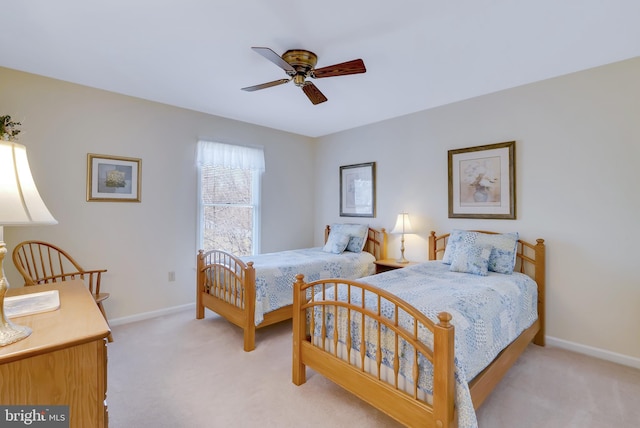 bedroom with baseboards, light carpet, and a ceiling fan