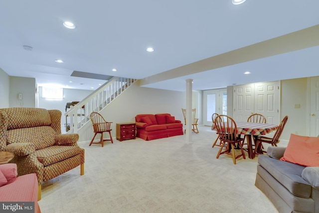 living room featuring recessed lighting, baseboards, carpet, and stairs