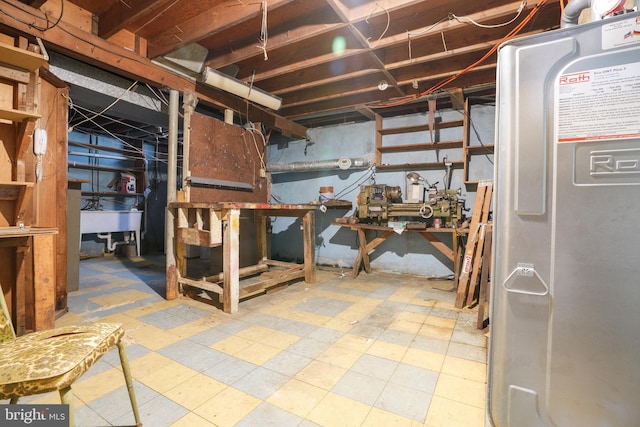 unfinished below grade area featuring tile patterned floors and a sink