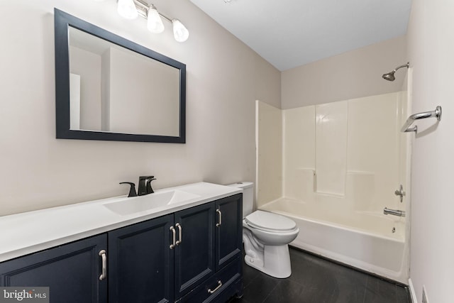 full bathroom with vanity, tile patterned floors, toilet, and washtub / shower combination