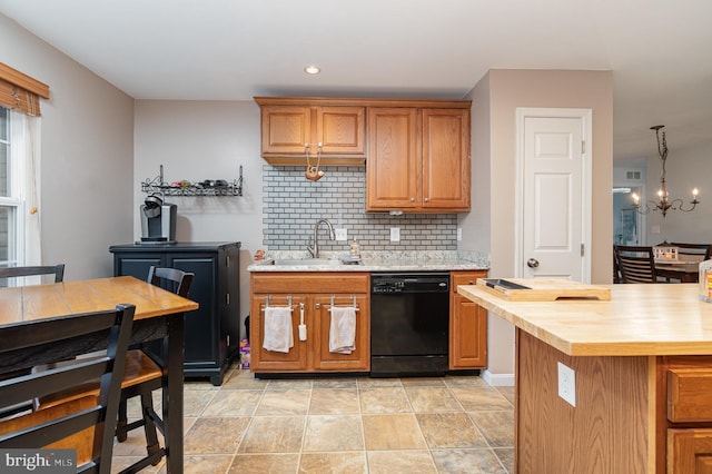 kitchen featuring a sink, decorative backsplash, wood counters, dishwasher, and a chandelier