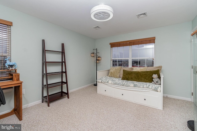 bedroom featuring light colored carpet, visible vents, and baseboards