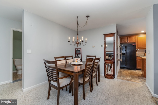 dining space featuring an inviting chandelier, recessed lighting, baseboards, and light carpet