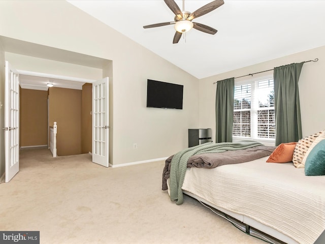 bedroom featuring a ceiling fan, baseboards, vaulted ceiling, french doors, and light carpet