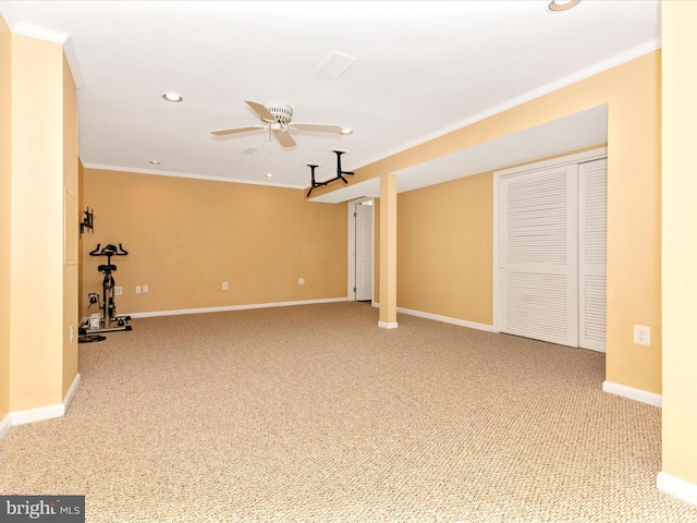 empty room with crown molding and light carpet