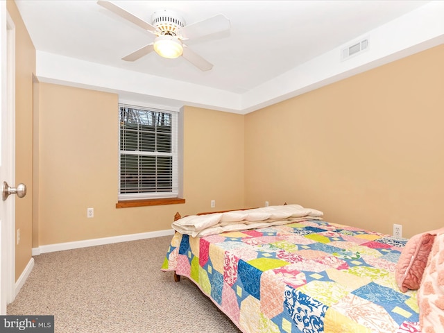 bedroom with baseboards, visible vents, carpet floors, and ceiling fan