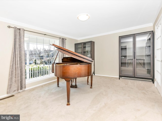 living area featuring crown molding, visible vents, baseboards, and carpet floors