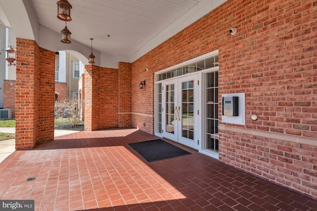 view of patio with french doors and central AC