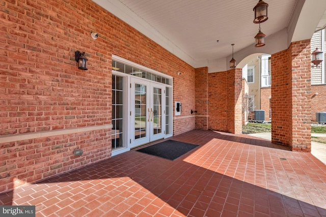 view of patio / terrace featuring french doors and cooling unit