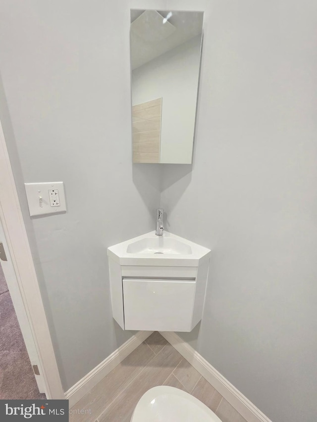 bathroom with vanity and baseboards