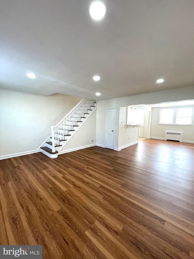 interior space with stairway, recessed lighting, baseboards, and dark wood-style flooring