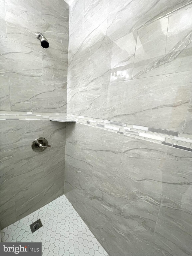 bathroom with tiled shower