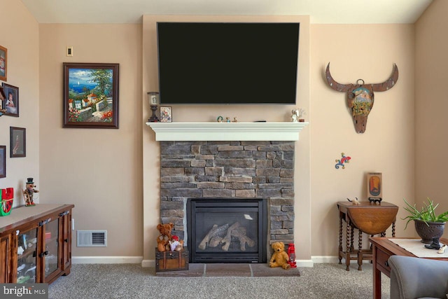 living room featuring a stone fireplace, baseboards, visible vents, and carpet floors