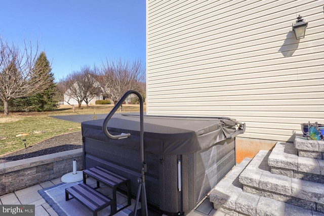 view of patio / terrace featuring area for grilling and a hot tub