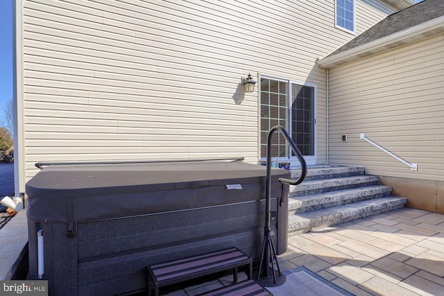 exterior details with a hot tub