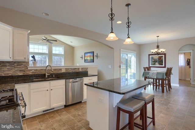 kitchen with range with gas stovetop, visible vents, a sink, dishwasher, and a wealth of natural light