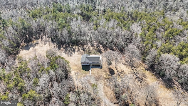 bird's eye view featuring a forest view