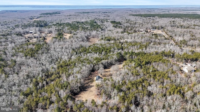 drone / aerial view featuring a forest view