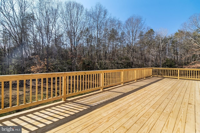 wooden terrace with a forest view